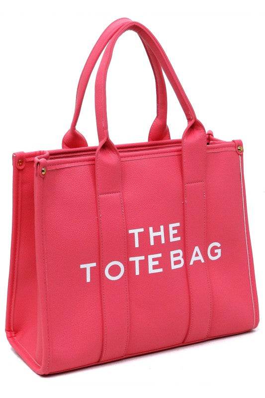 Pink large beach tote bag for women with dual handles and bold white text from Fashion World