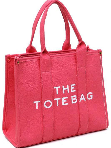 Pink large beach tote bag for women with dual handles and bold white text from Fashion World