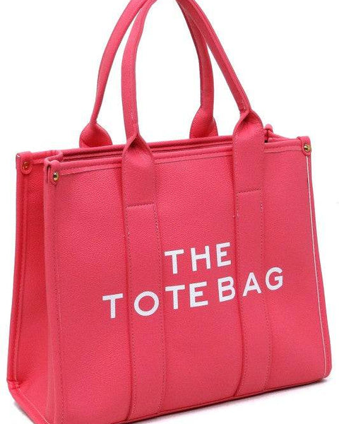 Pink large beach tote bag for women with dual handles and bold white text from Fashion World