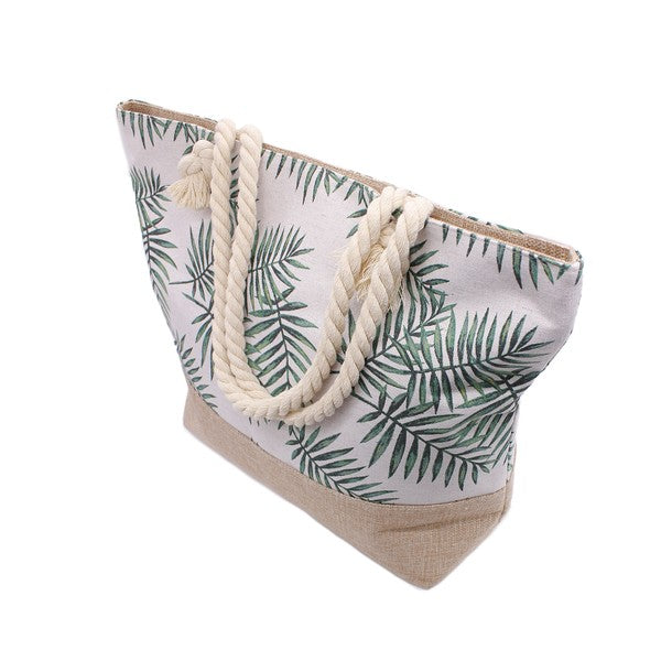Babe Beachwear tropical beach bag tote with green palm leaf print and rope handles side view