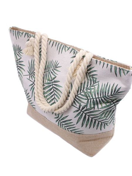 Babe Beachwear tropical beach bag tote with green palm leaf print and rope handles side view