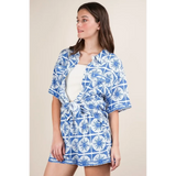 Babe Beachwear tropical blue shorts set with short sleeves and tie-front top on model