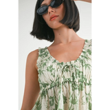 Emory Park Tropical Green Floral Tank Top with ruffled neckline worn by woman with sunglasses