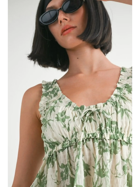 Emory Park Tropical Green Floral Tank Top with ruffled neckline worn by woman with sunglasses