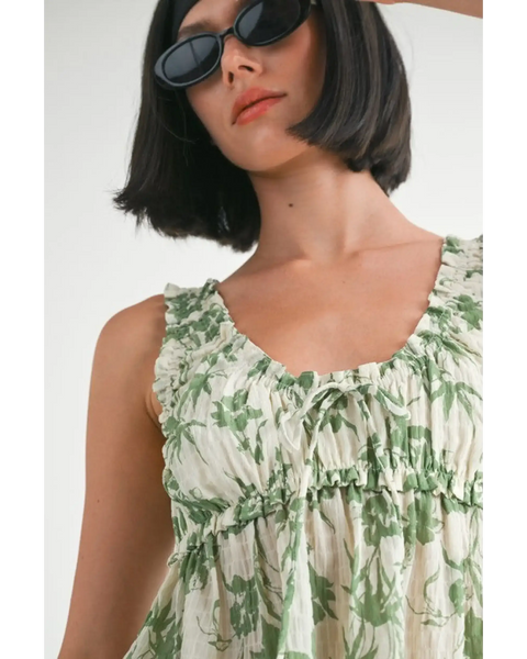 Emory Park Tropical Green Floral Tank Top with ruffled neckline worn by woman with sunglasses