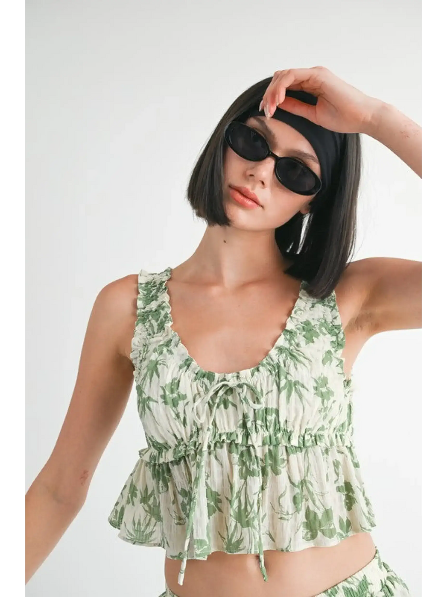 Emory Park Tropical Green Floral Tank Top with ruffle details worn by model with sunglasses