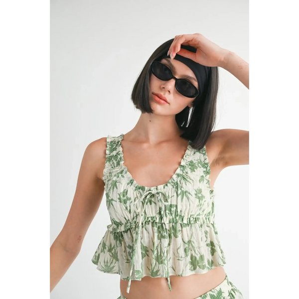 Emory Park Tropical Green Floral Tank Top with ruffle details worn by model with sunglasses