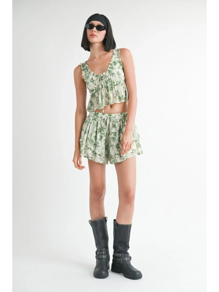 Emory Park Tropical Green Floral Tank Top styled with matching shorts and black boots on model
