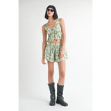 Emory Park Tropical Green Floral Tank Top styled with matching shorts and black boots on model