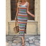 Woman wearing colorful Tropical Stripes Knit Midi Dress with side slit and carrying a straw bag