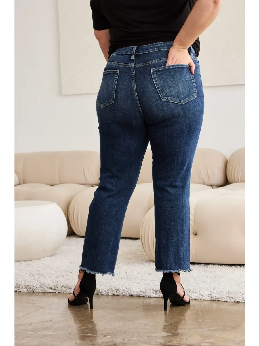 Trendsi tummy control high waist jeans in dark wash worn with black heels and black top from back view