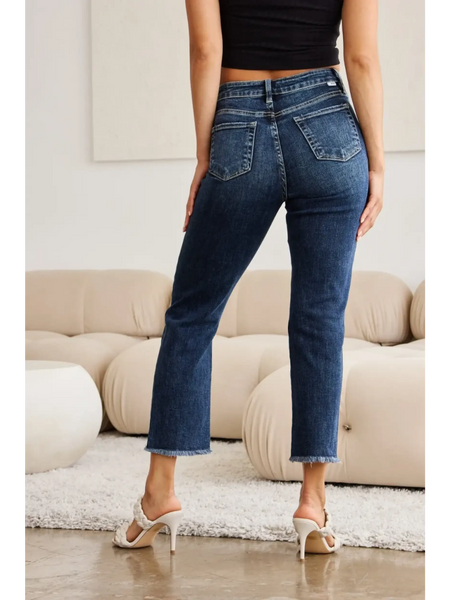 Trendsi women's tummy control high waist jeans in dark wash shown from back with raw hem