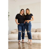 Two women wearing Trendsi tummy control high waist jeans with ripped knees and black tops indoors