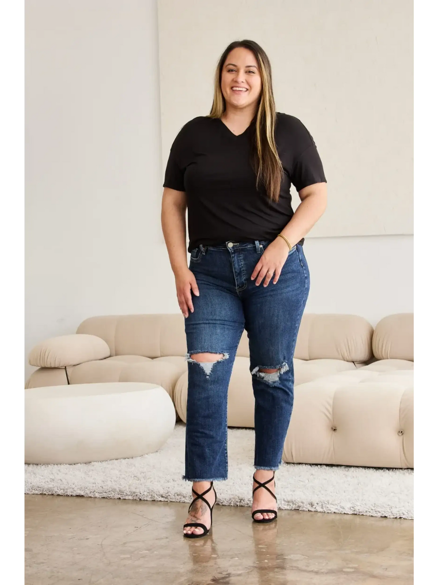 Trendsi tummy control high waist jeans in dark blue with distressed knees worn by smiling woman