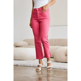 Trendsi pink tummy control high waist jeans worn with white top and sandals in modern living room
