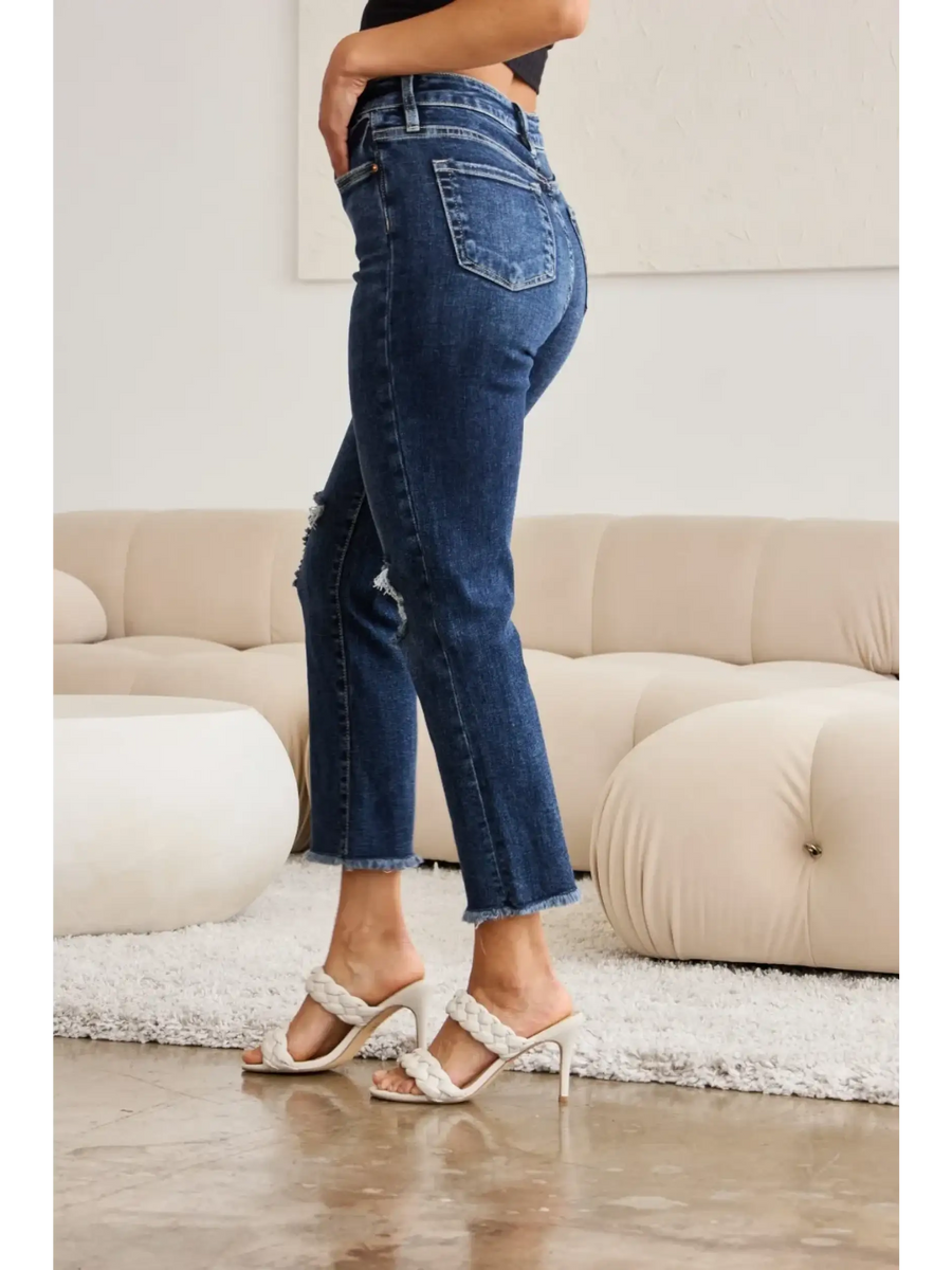 Trendsi tummy control high waist jeans in dark blue denim worn with white heeled sandals