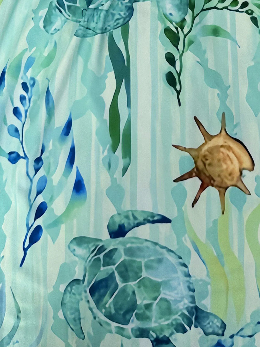 Babe Beachwear turquoise turtle beach dress featuring sea turtle and ocean plant design on mini dress fabric
