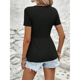 Babe Beachwaer sleeveless twisted front v-neck t-shirt for women in black worn with denim shorts