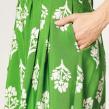 Green Umgee floral palazzo pants with white flower print and wide leg design from Trendsi
