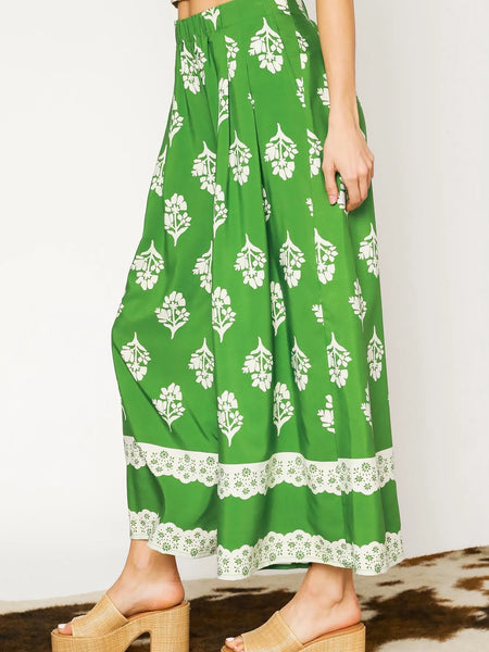 Green Umgee floral palazzo pants with white floral print and lace trim wide leg pants by Trendsi