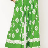 green wide leg pants featuring Umgee floral palazzo pants design with white floral patterns and lace trim