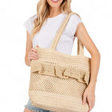 Artini Accessories unique ruffle straw bag carried by woman in casual white top and denim shorts