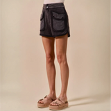 Trendsi vacation denim shorts for women in dark fabric with large front pockets styled with platform sandals