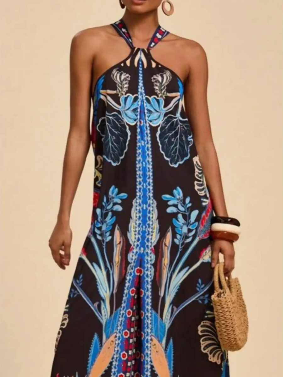 Babe Beachwear vacation halter jumpsuit outfit with vibrant blue floral print and relaxed fit