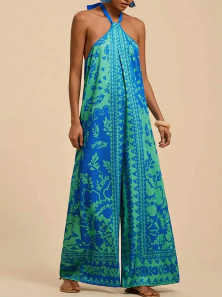 Babe Beachwear blue and green vacation halter jumpsuit outfit with wide legs and floral patterns