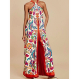 Babe Beachwear colorful floral vacation halter jumpsuit outfit with wide legs and red trim