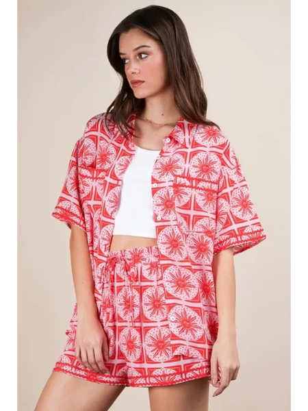 Babe Beachwear vacation printed top and shorts outfit in red and white tropical pattern