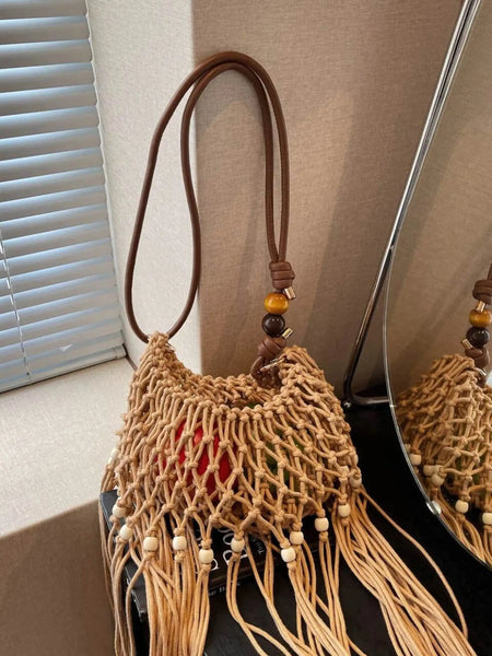Babe Beachwear vacation-ready boho handbag with woven design and wooden bead accents