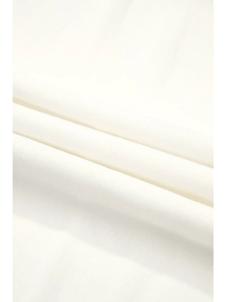 Close-up of white fabric texture for Trendsi vacation resort wide leg trousers