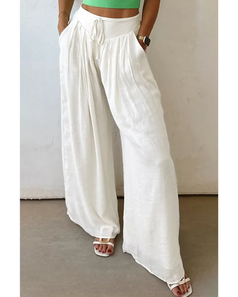 White vacation resort wide leg trousers from Trendsi worn with sandals and a green crop top
