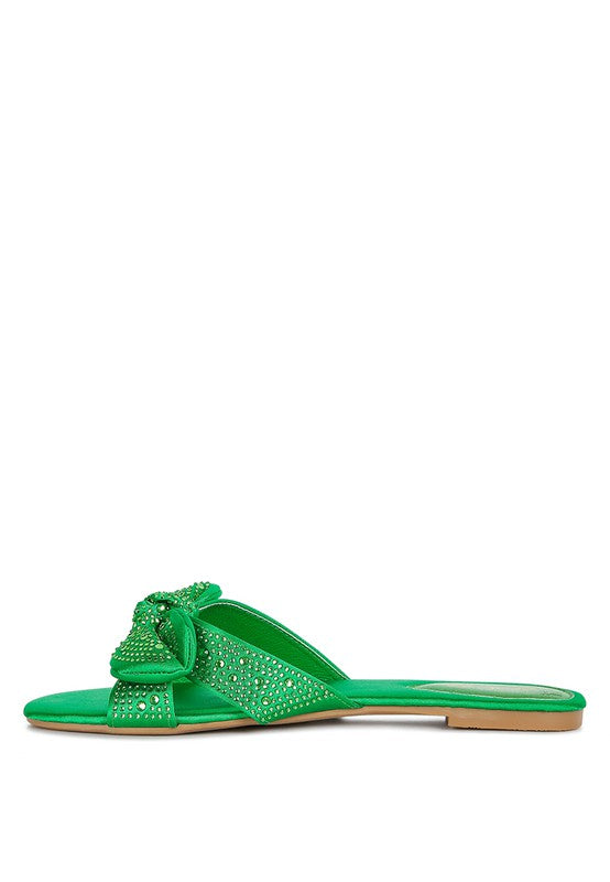 Rag Company green sandals with rhinestone embellishments and bow detail on flat sole