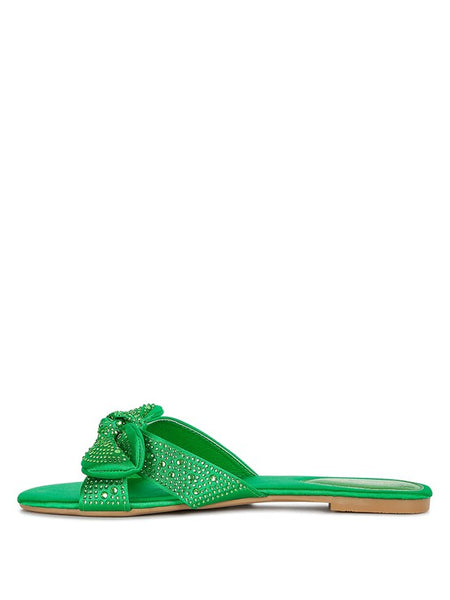 Rag Company green sandals with rhinestone embellishments and bow detail on flat sole