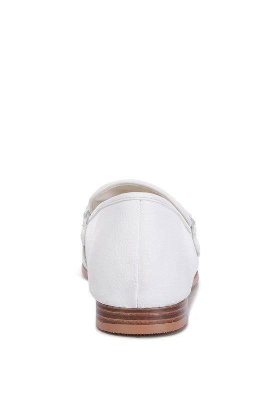 White Rag Company loafers with brown wooden sole viewed from the back