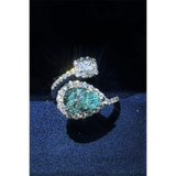 2 carat pear shaped Bypass ring sparkle featuring a pear-shaped blue gemstone and a square clear stone by Trendsi