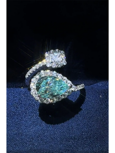 2 carat pear shaped Bypass ring sparkle featuring a pear-shaped blue gemstone and a square clear stone by Trendsi