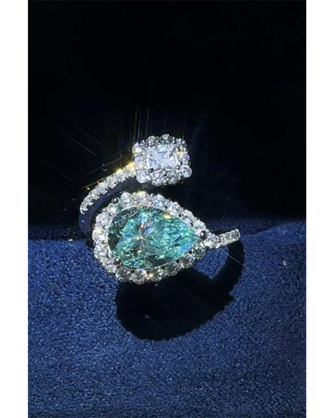 2 carat pear shaped Bypass ring sparkle featuring a pear-shaped blue gemstone and a square clear stone by Trendsi