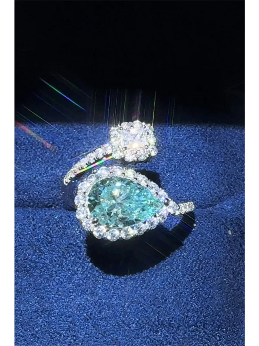 Babe Beachwear 2 carat pear shaped Bypass ring sparkle with a large pear-shaped center stone and surrounding smaller diamonds