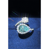 Babe Beachwear 2 carat pear shaped Bypass ring sparkle with a large pear-shaped center stone and surrounding smaller diamonds