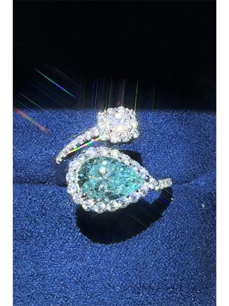 Babe Beachwear 2 carat pear shaped Bypass ring sparkle with a large pear-shaped center stone and surrounding smaller diamonds