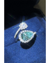 Babe Beachwear 2 carat pear shaped Bypass ring sparkle with a blue gemstone and diamond accents on silver band
