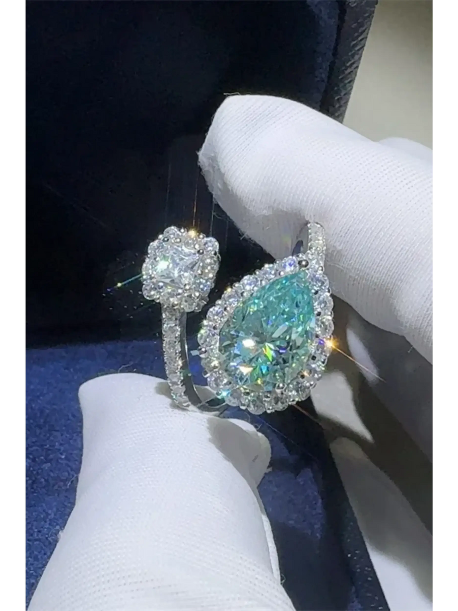 Babe Beachwear  2 carat pear shaped Bypass ring sparkle with a large pear shaped center stone and smaller surrounding diamonds