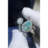 Babe Beachwear  2 carat pear shaped Bypass ring sparkle with a large pear shaped center stone and smaller surrounding diamonds