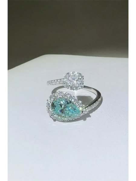Babe Beachwear 2 carat pear shaped Bypass ring sparkle with clear and blue gemstones on silver band