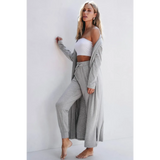 Trendsi 2 Pc Pants and Duster Leisure Set in light gray worn by woman posing barefoot