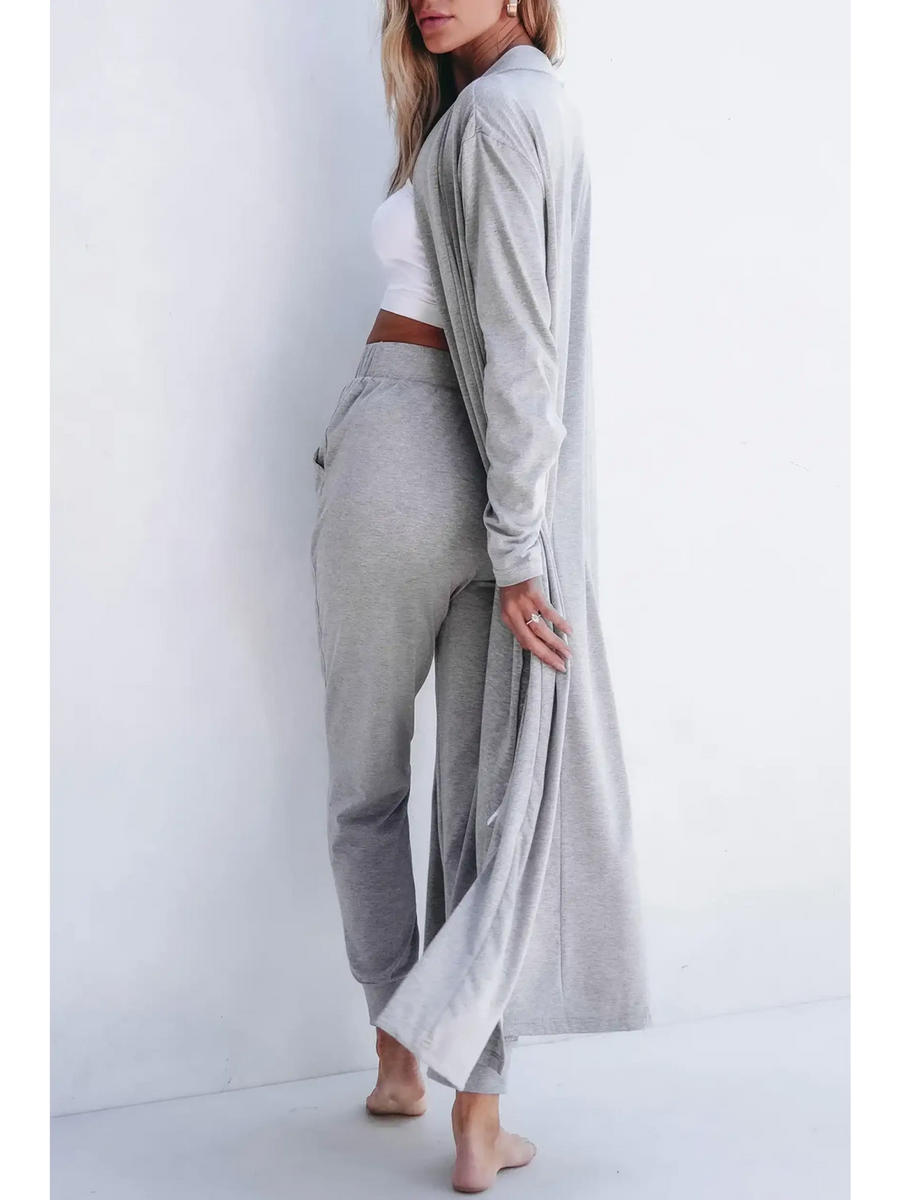 Trendsi 2 Pc Pants and Duster Leisure Set in light gray worn by woman barefoot against white background