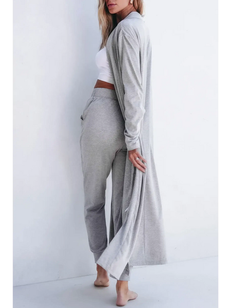 Trendsi 2 Pc Pants and Duster Leisure Set in light gray worn by woman barefoot against white background